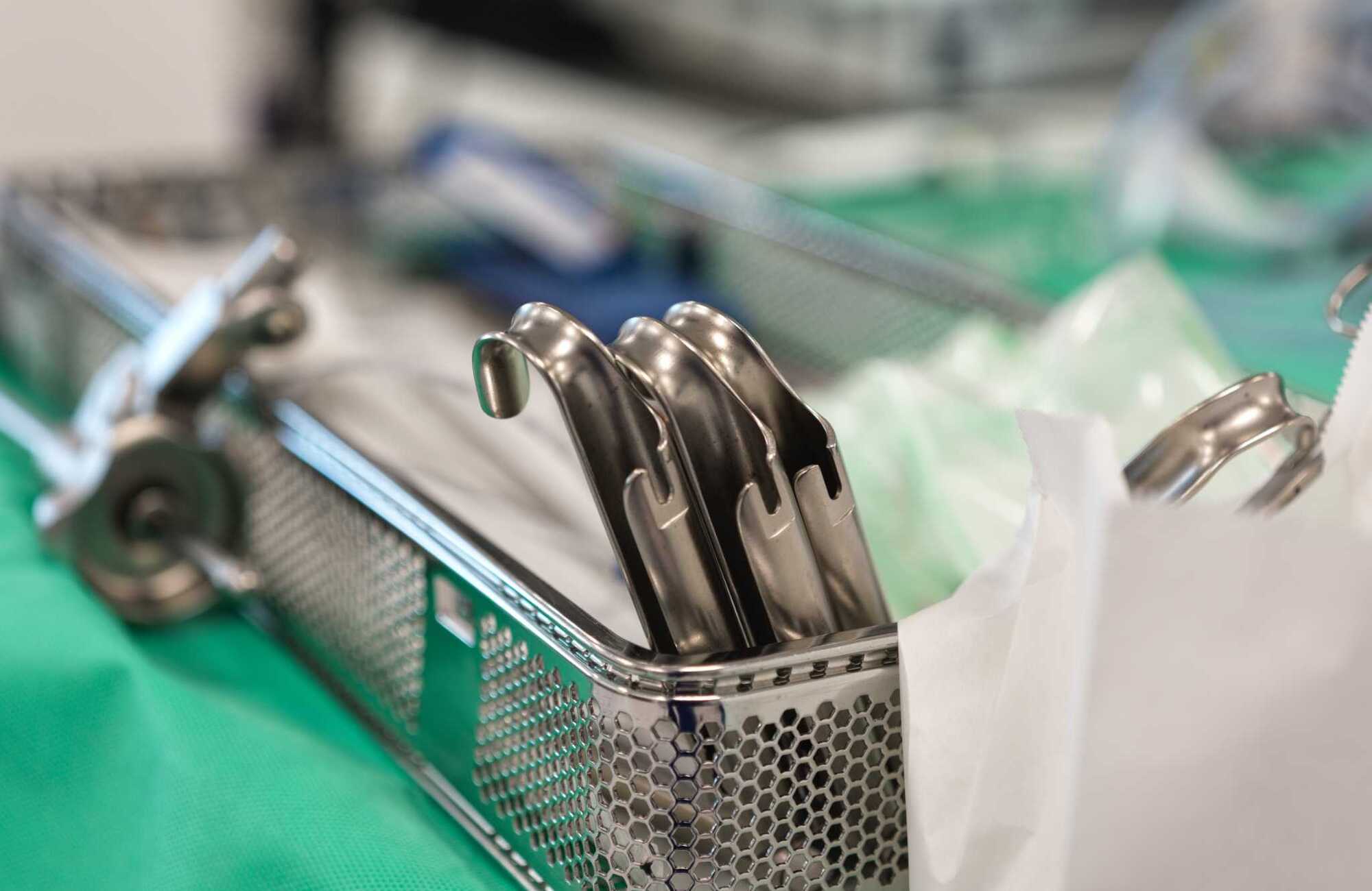 Photograph of a tray of metal medical devices prepared for a procedure