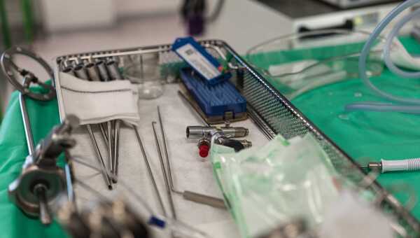 Photograph of a tray of metal medical devices prepared for a procedure