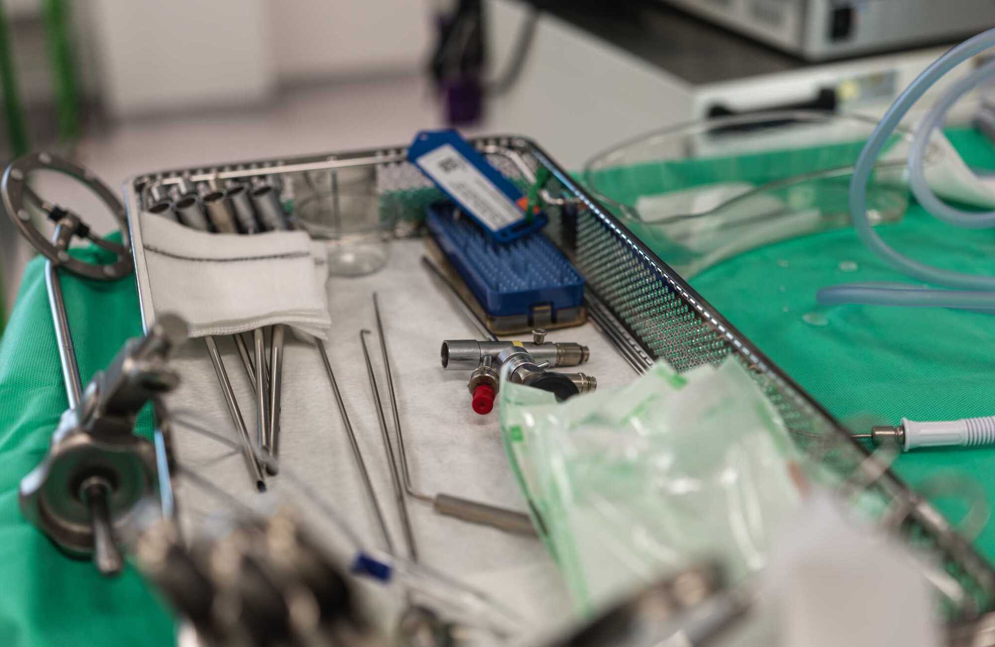 Photograph of a tray of metal medical devices prepared for a procedure